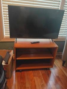lot 912 image: 40in Vizio Television with Rolling Stand.   Stand 22 x 30 x 18