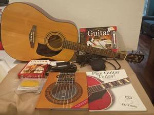 lot 921 image: Lyon Guitar with Variety of Guitar Lessons PLUS a Tuner, Extra Guitar Strings and Spectrum