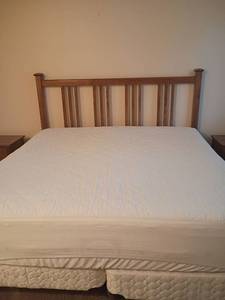 lot 923 image: King Sized Sealy Posturepedic Crown Jewel Mattress and Box Springs with Headboard    Headboard 53 x 80.  Comes with a mattress protector and a mattress topper.   Matches lots 926 and 928