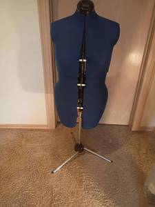 lot 933 image: Adjustable Dress Form.  Right now it stands at 48in. tall.  Located in basement