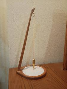 lot 947 image: Pit and Pendulum Desktop Accent Piece for Stress Relief.  22in. tall.  Located in basement