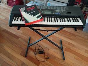 lot 961 image: Casio Electronic Keyboard with Adjustable Stand and How To Book