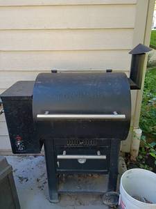 lot 966 image: Traeger Pellet Stove with Bucket of Pellets.  Has a cover