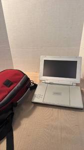 lot 1014 image: Audiovox portable dvd player with case, remote and cords