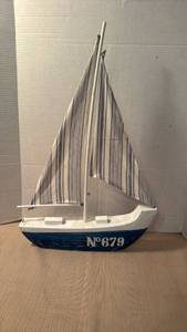 lot 1024 image: Wooden decorative sailboat with fabric sails 22x13