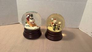lot 1025 image: 2 Holiday music box Snow Globes Snowman and Bear Figurines Wood Base