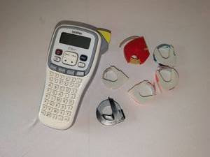lot 1100 image: Brother P-touch Label Maker with Dymo Tape Cartridges
