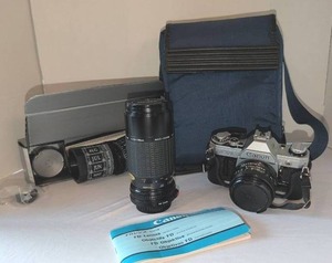 lot 1110 image: Canon AE-1 SLR Camera with Sigma 57-210mm and Canon 50mm Lenses and Stellarscope