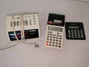 lot 1137 image: RadioShack Programmable control center and timer and Casio HR 7 Printing calculator