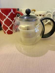 lot 1222 image: Dunkin Dunkin Decaf Medium Roast Ground Coffee - 12oz opened with tea diffuser  and coffee cups
