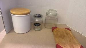 lot 1267 image: Glass and ceramic jars, small wooden cutting board and wine corks