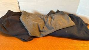 lot 1321 image: Two sweat pants - M and a pair of 36 shirts