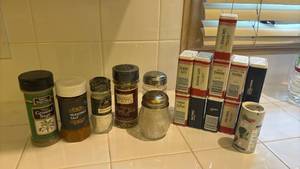 lot 1462 image: Spice and Seasoning Containers with Mixed Herbs Salt Pepper