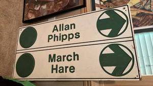 lot 2010 image: Allen Phipps March Hare Directional sign - 24 x 28 - Located in BasementLocated in Basement