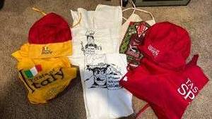 lot 2033 image: Taste of Spain and Taste of Italy Promotional Chef Hats and Aprons, plus WSU chili cookoff  aprons