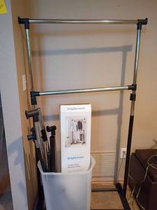 lot 2065 image: Clothing Rack plus parts or a different clothing rack.   Located in basement