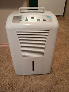 lot 2072 image: GE Dehumidifier.  23in tall.  Located in basement