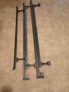 lot 2077 image: Adjustable Metal Bed Frame.  Located in basement