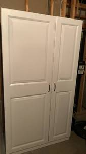 lot 2205 image: White 2-Door Cabinet with Shelving Unit 71x39x21 located in basement