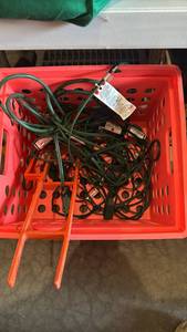 lot 3113 image: Extension cords in plastic milk crate