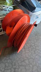 lot 3129 image: Extension cord on reel and extra reel