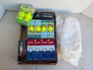 lot 3218 image: Golf ball assortment and rain poncho