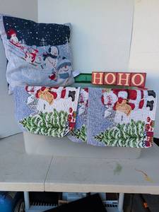 lot 3339 image: Holiday Textile Lot pillow, placemats, Oven Mitts HOHO Sign Christmas Decor in tub