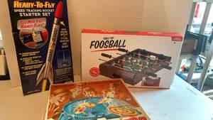 lot 3502 image: Games including Battling Tops, Foosball and a Rocket set