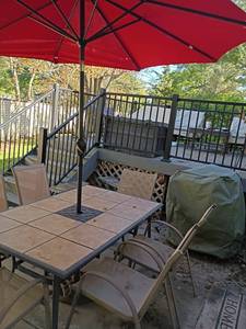 lot 4133 image: Outdoor Patio Table with 6 Chairs and Umbrella.  Table is 28in tall.  With Umbrella 98 x 63 x 39