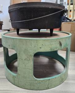 lot 1163 image: (1) 14 in Lodge Cast Iron Dutch Oven with Lid and (1) Stacking Storage. Last Picture depicts how stackers work if you buy more than one. - Retail $0