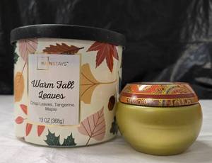 lot 1179 image: Mainstays Warm Fall Leaves 13 OZ Candle and Sparkling Cinnamon Soy Coconut Wax Candle Lot. Never Used - Retail $0