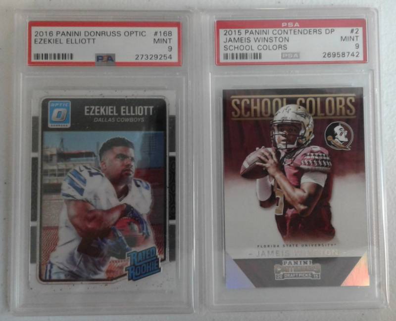 lot 1021 image: Two Profesionally Graded PSA 9 MINT Rookie Cards Ezekiel Elliott Optics Rated Rookie & Jameis Winston Contenders School Colors