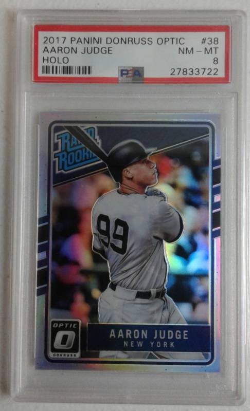 lot 1028 image: Near Mint PSA 8 Professionally Graded 2017 Donruss Optic Aaron Judge Rated Rookie Holo Prizm New York Yankees