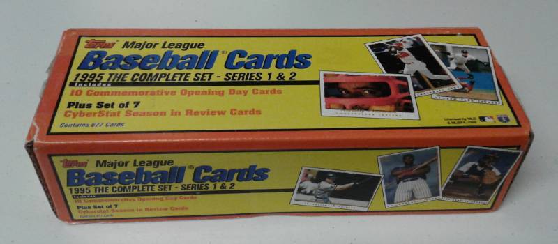 lot 1089 image: Complete Mint 1995 Topps Baseball Cards Series 1 & 2 In Christmas Wrapped Box - All 677 Baseball Cards