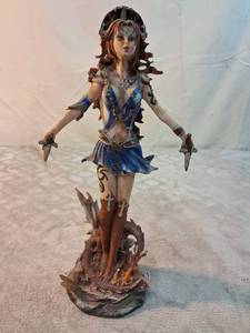 lot 42 image: Fantasy Female Warrior Figurine with Daggers and Base approximately 9 inches