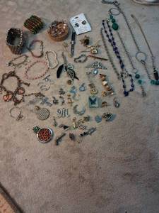 lot 51 image: Lot of Assorted Jewelry Charms Pendants Necklaces Bracelets