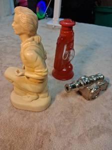 lot 59 image: Avon Minuteman Decanter Wild Country After Shave 4 FL OZ with Revolutionary Cannon Bottle