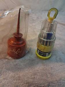 lot 74 image: Jubi Lee Oil Can and Multi-Bit Screwdriver Set 2 Pieces