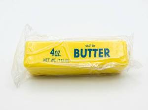 lot 88 image: Butter Squishy Toy Stick Replica 4oz Salted Butter Design