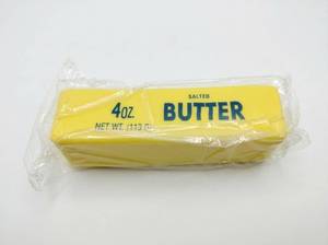 lot 89 image: Butter Squishy Toy Stick Replica 4oz Salted Butter Design