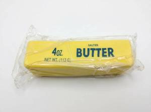 lot 90 image: Butter Squishy Toy Stick Replica 4oz Salted Butter Design