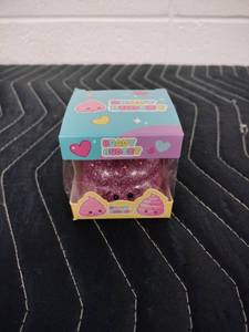 lot 144 image: Brady Budeey Pink Glitter Poop Emoji Squishy Toy in Display Box