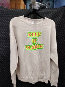 lot 9102 image: Jerzees Nublend XL Crewneck Sweatshirt Tan w Keep It Player Neon Graphic