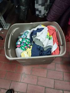 lot 9198 image: Assorted Kids Clothing Lot in Plastic Tote - Shirts, Pajamas, Hoodies