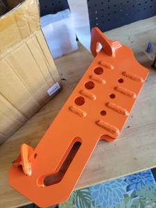 lot 7748 image: Orange skid steer arm extensionattachment