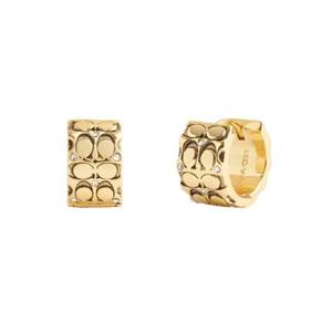 lot 2863 image: Coach Quilted C Huggie Earrings Golden One Size