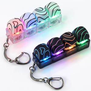 lot 14028 image: Hyekit 2 Pcs LED Keyboard Fidget Toy Illuminated Contour Keycaps Keychain