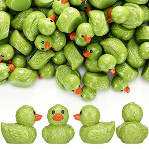 lot 6367 image: Chunful Mini Resin Christmas Duck Figurines  Lime Green (missing some)