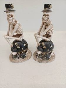 lot 12632 image: Set of 2 Resin Skeleton Figurines w Top Hats on Black Jack-o-Lantern Pumpkin