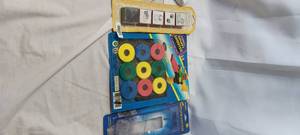 lot 2229 image: Galaxy shooter 9pc disc pack, Dog stamps and bookmark magnifier
